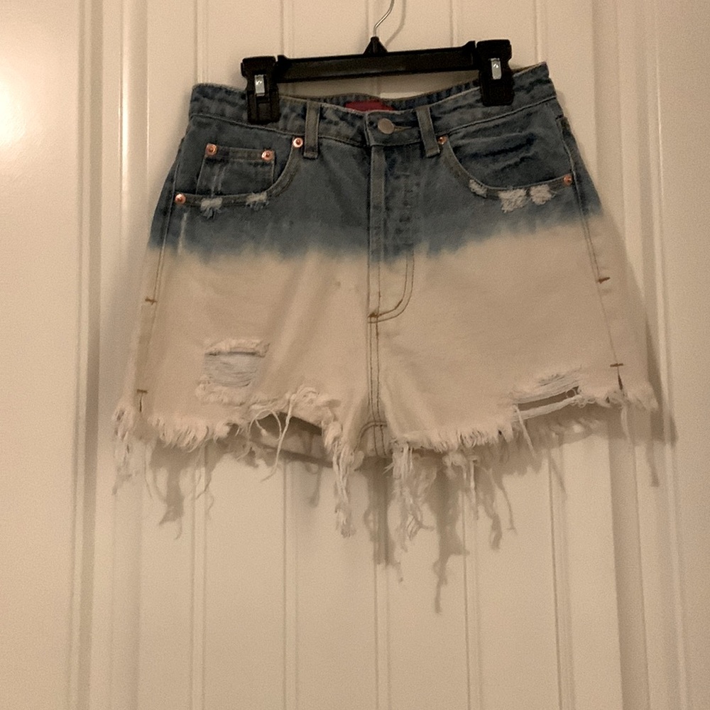 Two toned denim high waisted, cutoff short. Size small. Never worn.